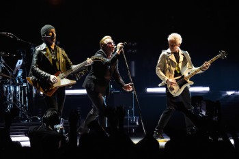 VANCOUVER, BC - MAY 14:  (L-R) Musicians, The Edge, Bono and Adam Clayton of U2 perform onstage during the U2 iNNOCENCE + eXPERIENCE tour opener in Vancouver at Rogers Arena on May 14, 2015 in Vancouver, Canada.  (Photo by Kevin Mazur/WireImage)