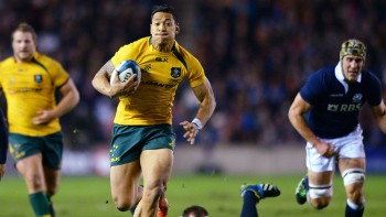 EDINBURGH, SCOTLAND - NOVEMBER 23 : Israel Folau of Australia breaks free from Moray Low and the Scottish defence to scores a try during the Scotland v Australia Autumn International Series Match at Murrayfield Stadium on November 23, 2013 in Edinburgh, Scotland. (Photo by Mark Runnacles/Getty Images)