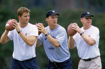 UNITED STATES - JUNE 01: Football: Manning Passing Academy, (L-R) Closeup of Mississippi QB Eli Manning, Indianapolis Colts QB Peyton Manning, and former QB Archie Manning in action during practice drill for high school quarterbacks at Southeastern Louisiana, Hammond, LA 6/1/2002--8/31/2002 (Photo by Bill Frakes/Sports Illustrated/Getty Images) (SetNumber: X66355 TK1 R2 F5)